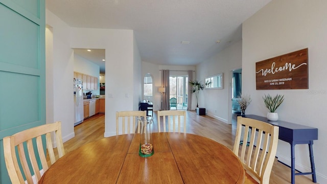 dining room with light wood-type flooring