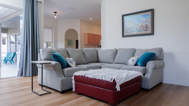 living room with light hardwood / wood-style flooring