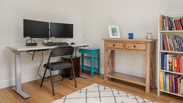 office space with light wood-type flooring