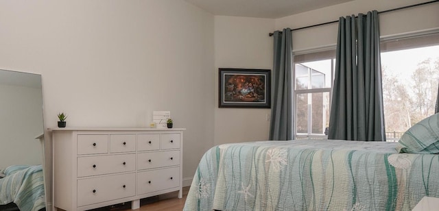 bedroom with light wood-type flooring