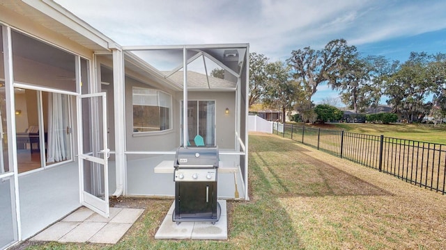 view of yard with glass enclosure