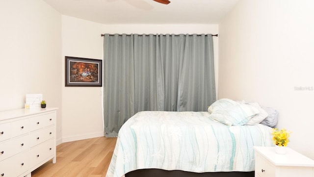 bedroom featuring ceiling fan and light wood-type flooring