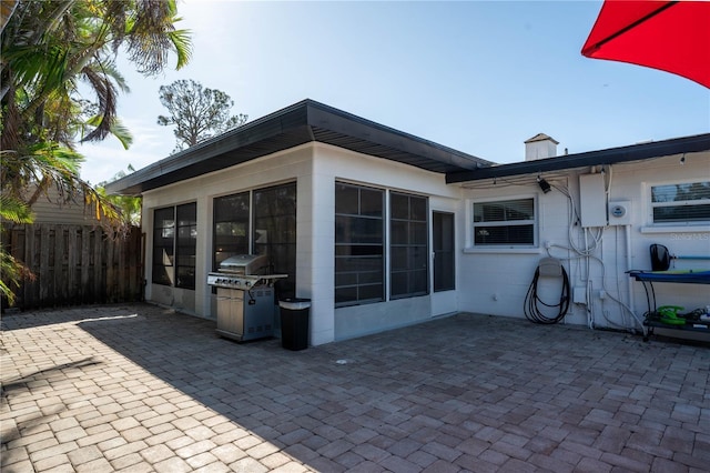 back of property featuring a patio