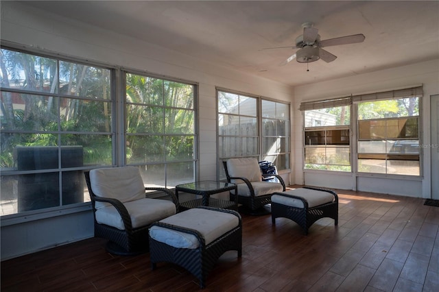 sunroom / solarium featuring ceiling fan