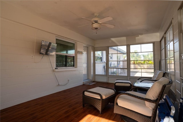 sunroom / solarium featuring ceiling fan