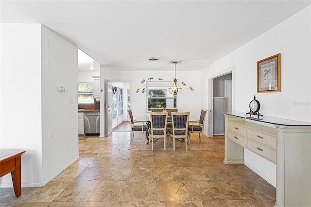 1309 Nokomis Ave S, Venice, FL 34285 - dining space featuring light stone finish flooring