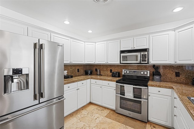 1309 Nokomis Ave S, Venice, FL 34285 - kitchen featuring stainless steel appliances, tile counters, decorative backsplash, white cabinets, and recessed lighting