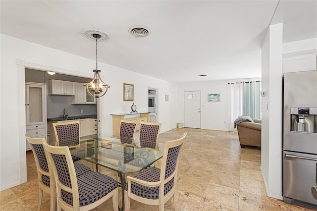 1309 Nokomis Ave S, Venice, FL 34285 - dining area with a chandelier
