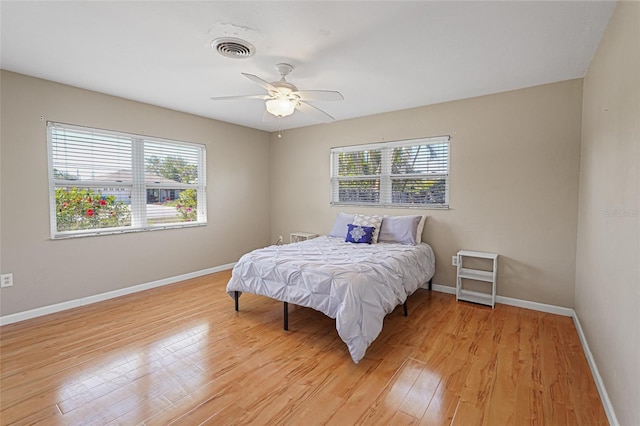 1309 Nokomis Ave S, Venice, FL 34285 - bedroom featuring multiple windows, light wood-style floors, and ceiling fan