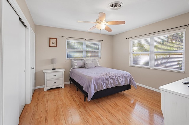 1309 Nokomis Ave S, Venice, FL 34285 - bedroom with multiple windows, light wood-style flooring, and a closet