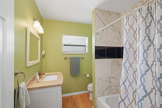 1309 Nokomis Ave S, Venice, FL 34285 - bathroom with vanity, wood finished floors, and shower / bathtub combination with curtain
