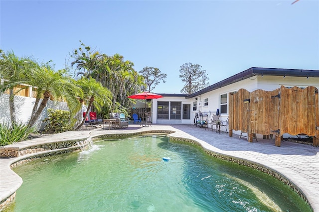 1309 Nokomis Ave S, Venice, FL 34285 - view of pool featuring a patio, a fenced backyard, and a sunroom