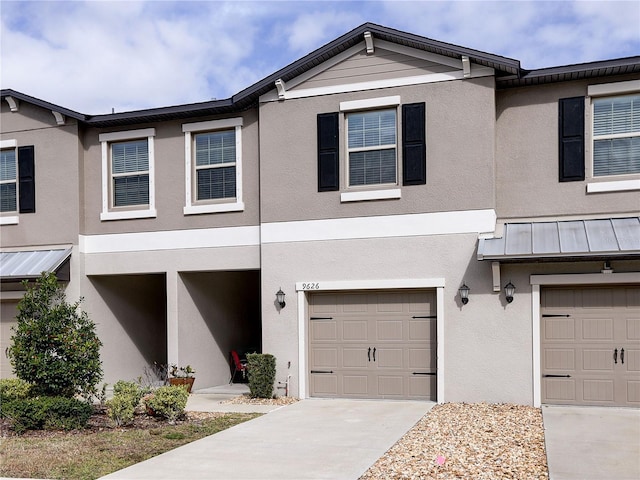 townhome / multi-family property featuring a garage