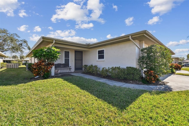 single story home with a front yard