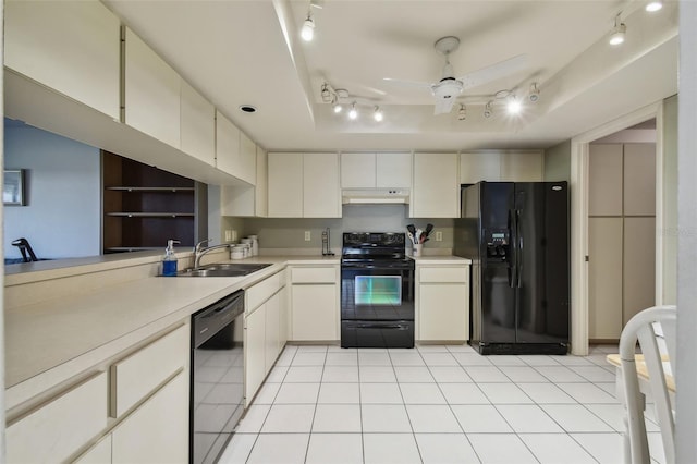 kitchen featuring light tile patterned flooring, black appliances, sink, ceiling fan, and kitchen peninsula