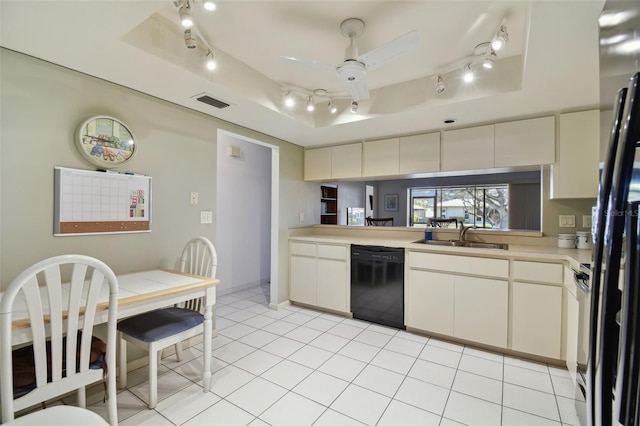 kitchen featuring sink, a raised ceiling, black dishwasher, and ceiling fan