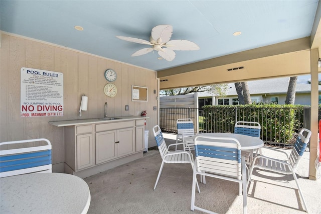 view of patio / terrace featuring sink and ceiling fan