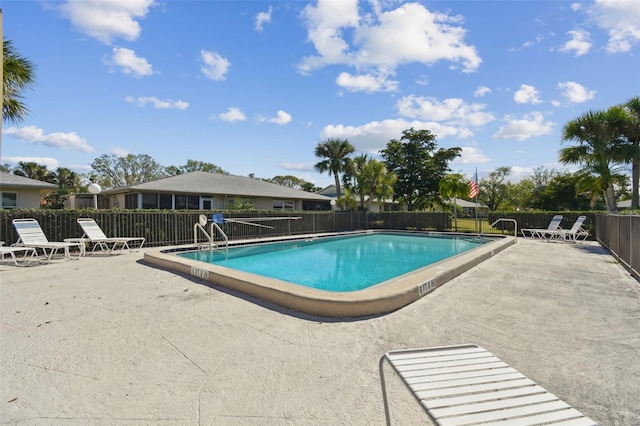 view of swimming pool with a patio