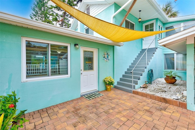 property entrance with a patio area