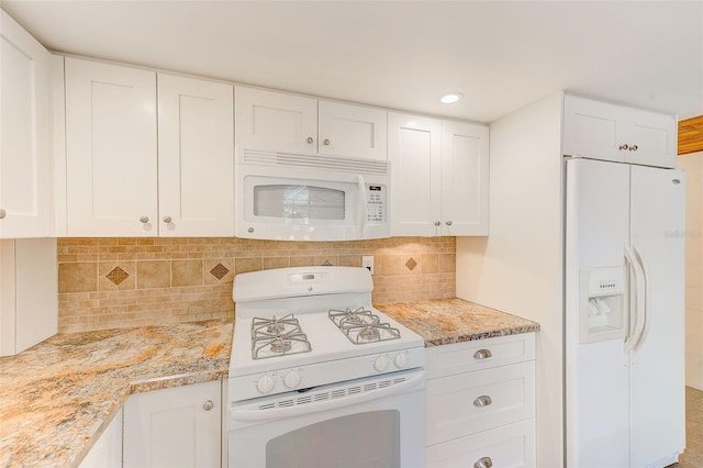 kitchen featuring backsplash, white cabinets, white appliances, and light stone counters