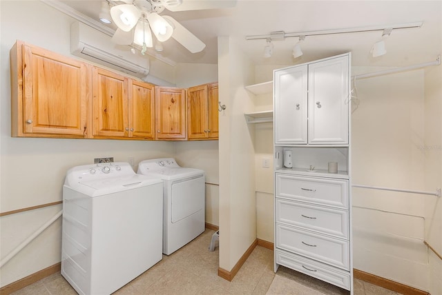 washroom featuring cabinets, ceiling fan, independent washer and dryer, and a wall unit AC