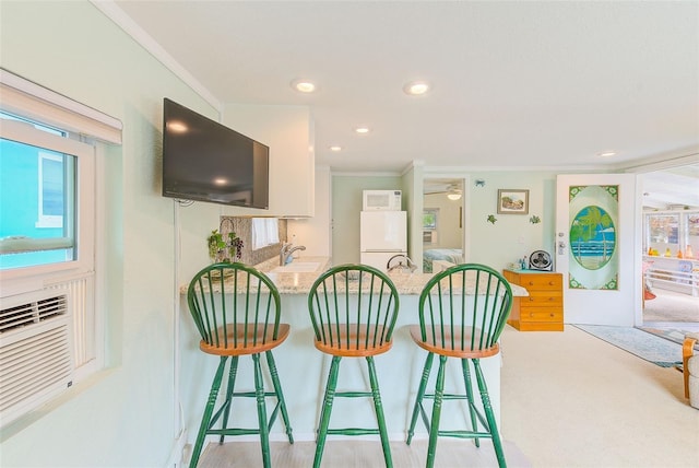 interior space with crown molding and sink