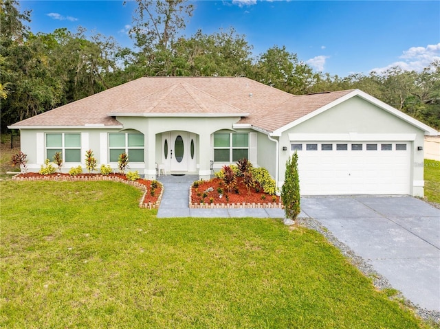 ranch-style house with a garage and a front yard