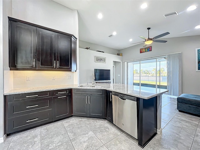 kitchen with tasteful backsplash, dishwasher, sink, and kitchen peninsula