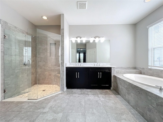 bathroom featuring plus walk in shower and vanity