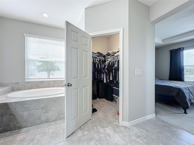 bathroom with tiled tub