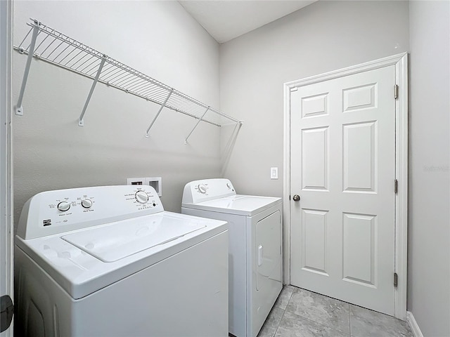 laundry area with separate washer and dryer