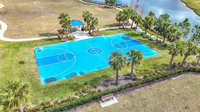 view of sport court featuring a gazebo, a water view, and a yard