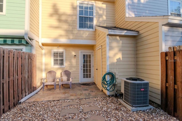 exterior space with a patio area and central air condition unit