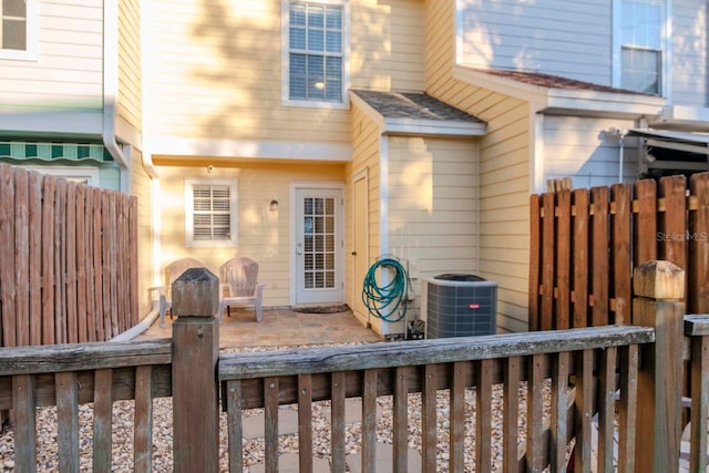 back of house featuring a patio and central air condition unit