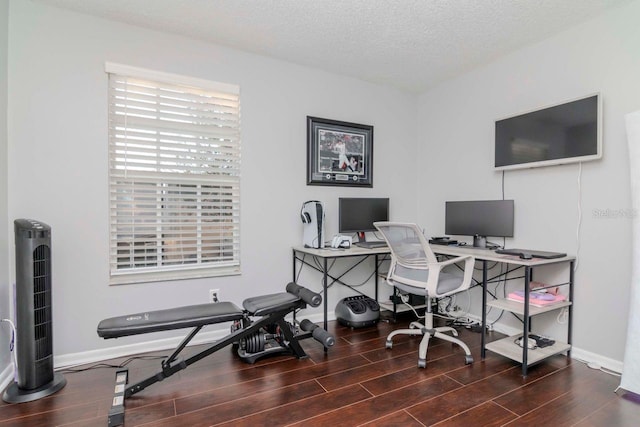 office featuring dark hardwood / wood-style floors and a textured ceiling