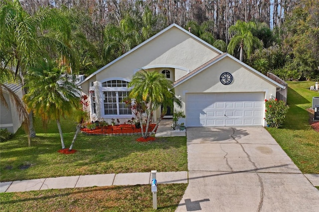 single story home with a garage and a front lawn