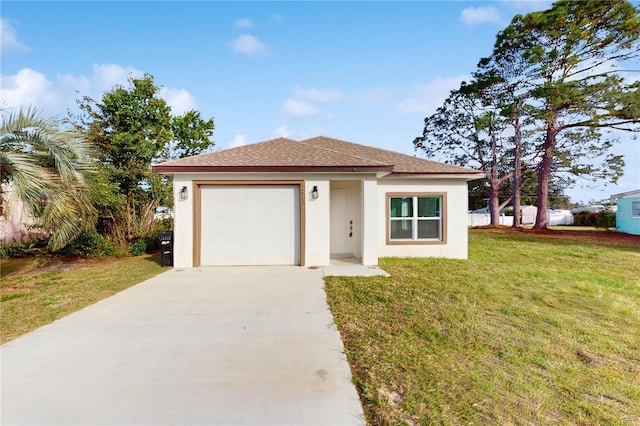 view of front of property featuring a garage and a front yard