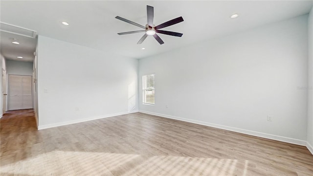 unfurnished room featuring ceiling fan and light hardwood / wood-style floors