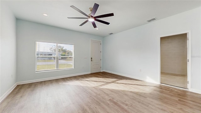 unfurnished room with ceiling fan and light hardwood / wood-style flooring