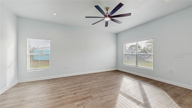 empty room featuring ceiling fan and light wood-type flooring