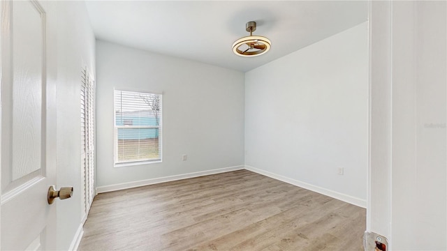 unfurnished room with light hardwood / wood-style floors