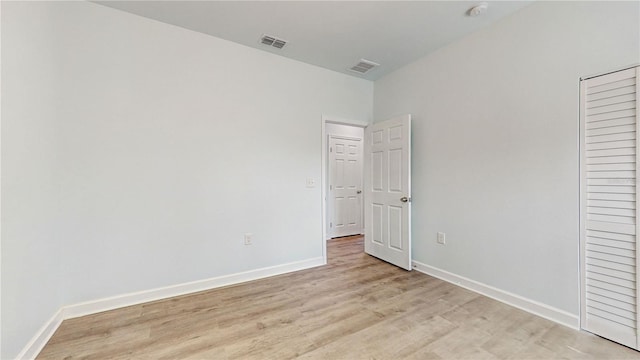 unfurnished bedroom with light wood-type flooring