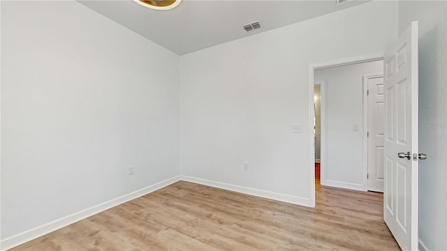 unfurnished room featuring light hardwood / wood-style flooring