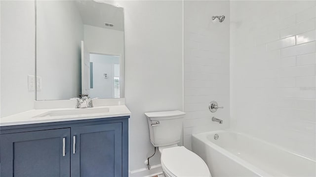 full bathroom featuring vanity, toilet, and tiled shower / bath