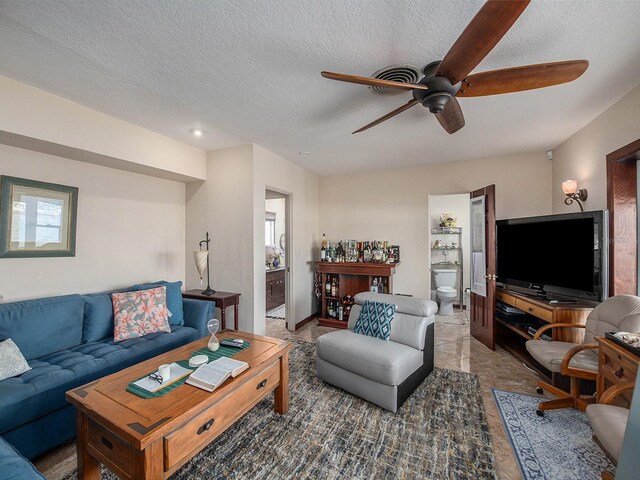 1818 Dolphin Blvd S, Saint Petersburg, FL 33707 - living room with a textured ceiling and ceiling fan
