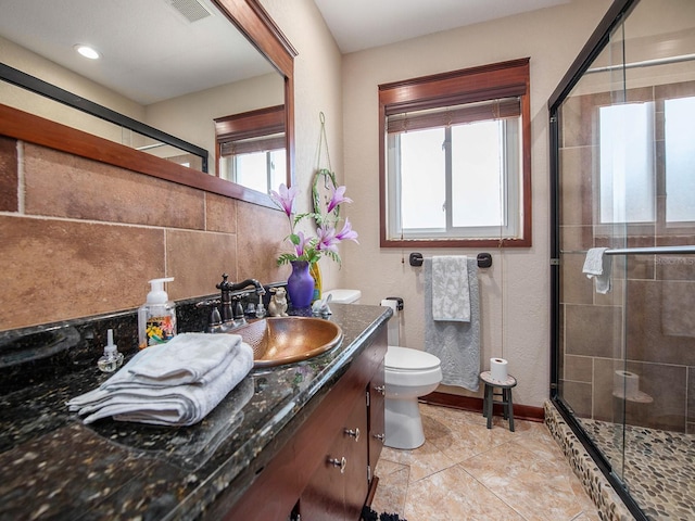1818 Dolphin Blvd S, Saint Petersburg, FL 33707 - bathroom featuring vanity, a shower with shower door, and toilet