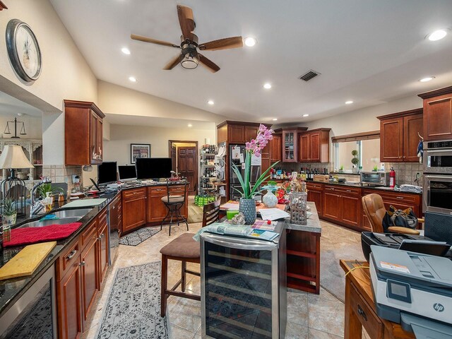 1818 Dolphin Blvd S, Saint Petersburg, FL 33707 - kitchen featuring sink, ceiling fan, backsplash, vaulted ceiling, and beverage cooler