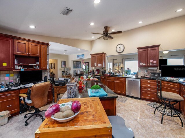 1818 Dolphin Blvd S, Saint Petersburg, FL 33707 - kitchen with butcher block countertops, dishwasher, decorative backsplash, ceiling fan, and kitchen peninsula