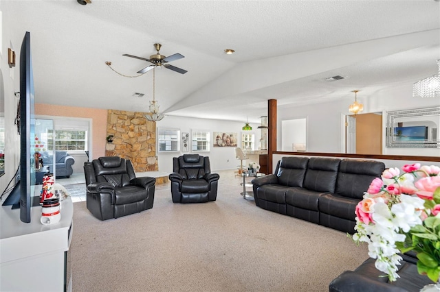 living room with ceiling fan, lofted ceiling, and a textured ceiling