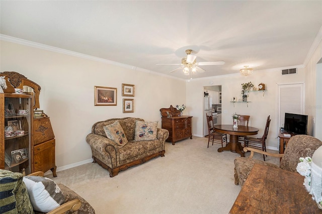 carpeted living room with ornamental molding and ceiling fan